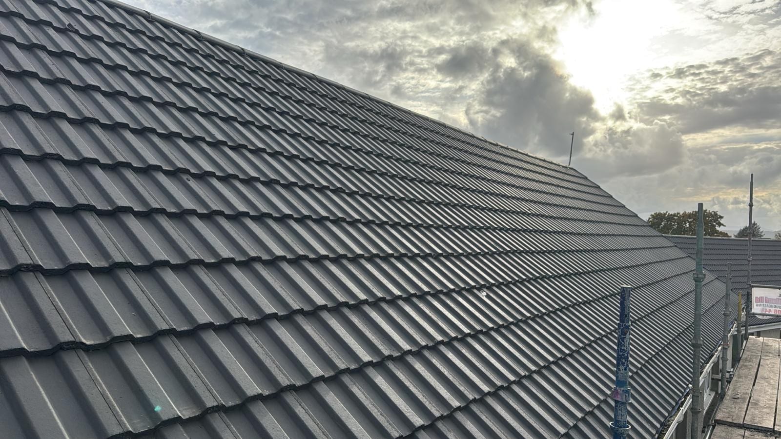 Finished charcoal Marley Major concrete tile roof with straight, even courses