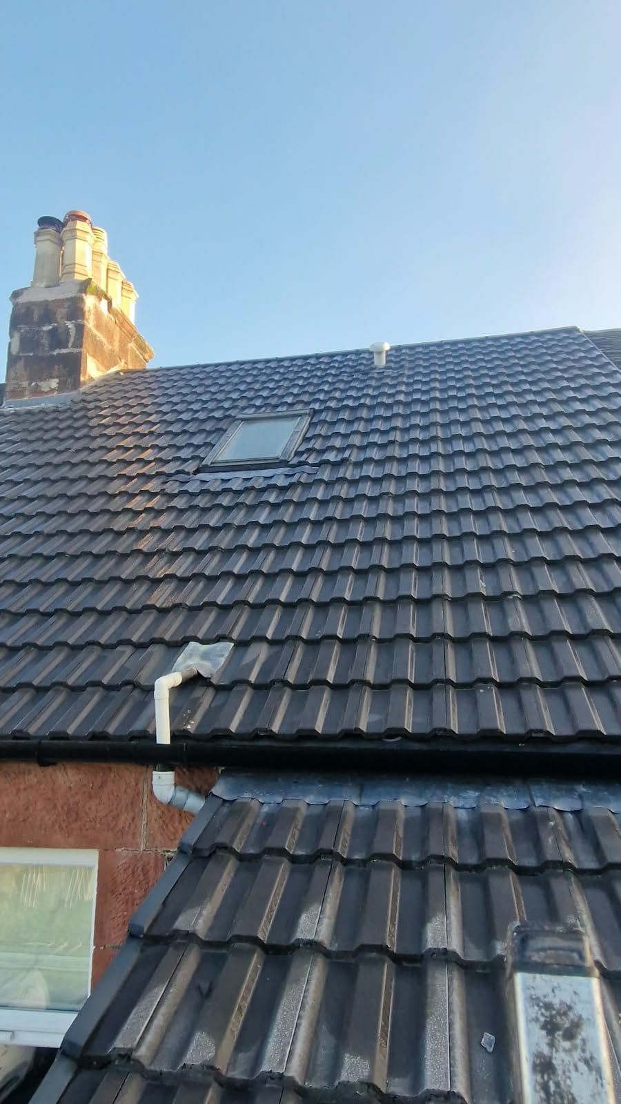 New Marley Major concrete tile roof with a roof light beside the chimney